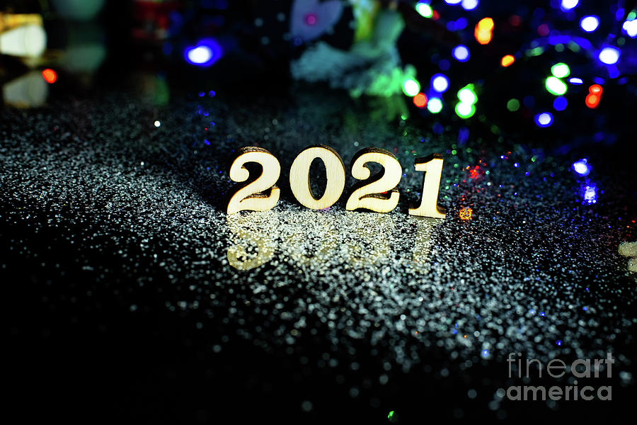 2021 happy new year wood number Christmas decoration and snow with bright background and copy space Photograph by Joaquin Corbalan