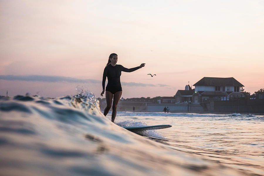 Water Women Friends Surfing Together At Sunset Photograph By Cavan 