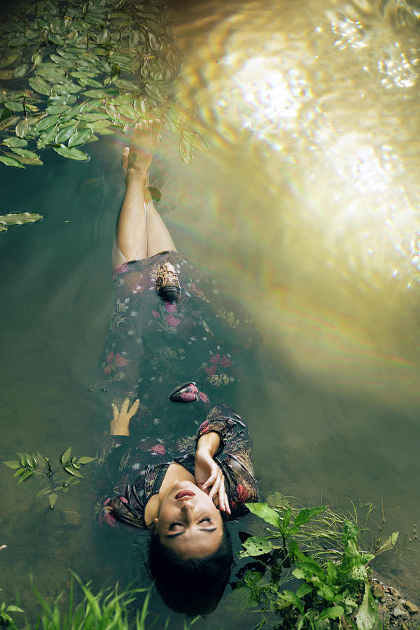 A Girl In A Beautiful Dress In The Water Photograph by Cavan Images ...