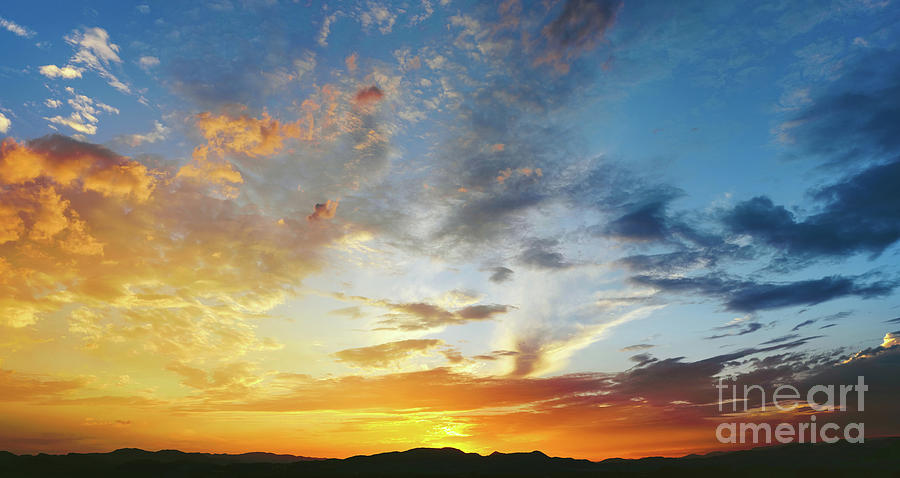 Beautiful sunset with the sun of orange tones behind the mountains and deep blue sky #3 Photograph by Joaquin Corbalan