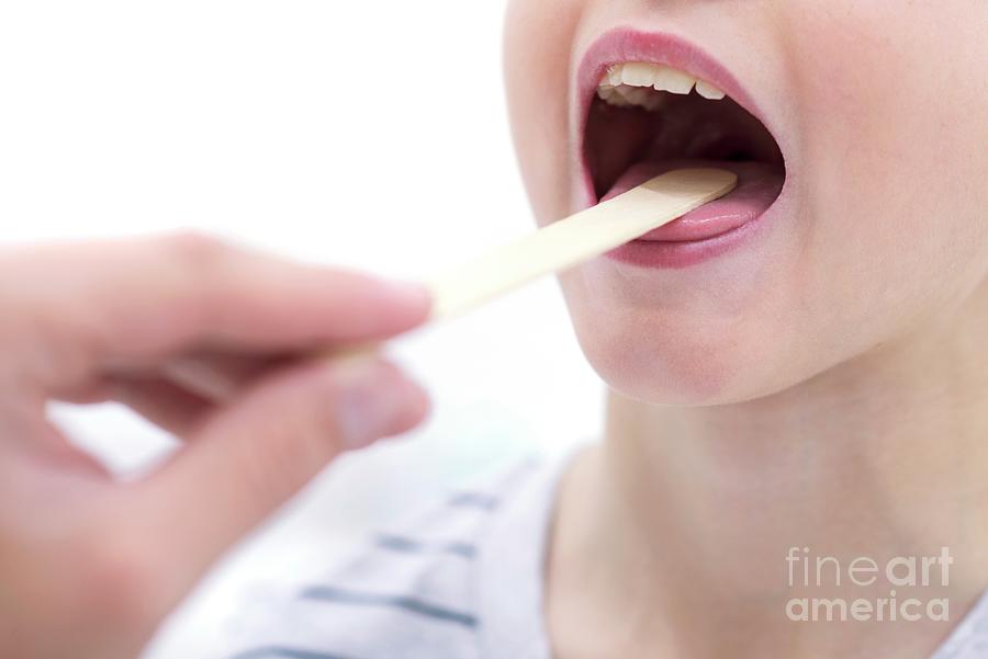 Boy With Mouth Open And Tongue Depressor #3 by Science Photo Library