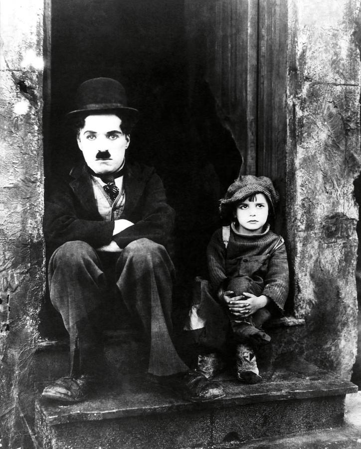 CHARLIE CHAPLIN and JACKIE COOGAN in THE KID -1921-. #3 Photograph by Album