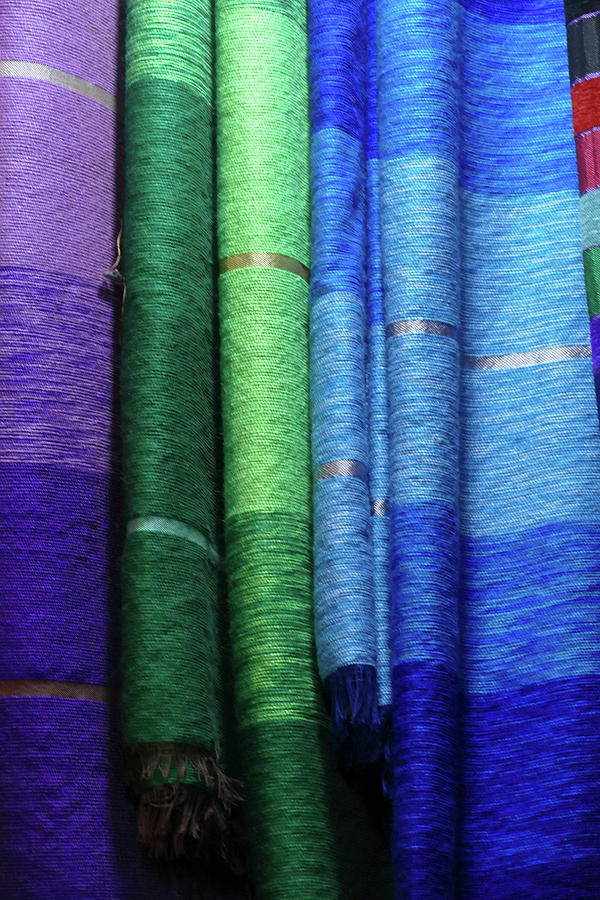 Colorful fabrics in the medina market  #3 Photograph by Steve Estvanik