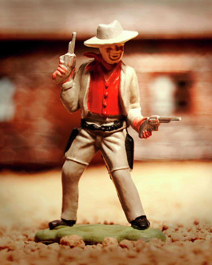 cowboy shooting two guns