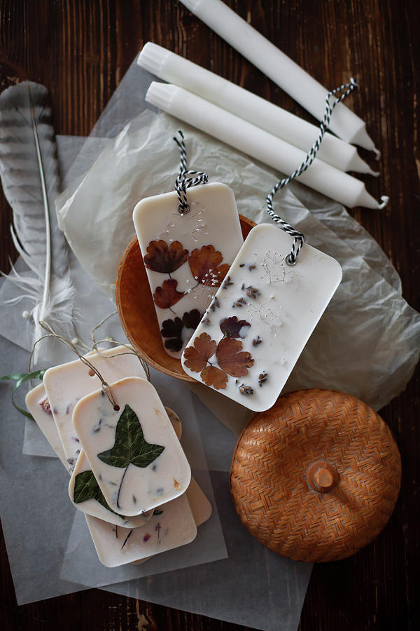 Handmade Scented Wax Tablets With Flowers And Leaves Lying On Tissue Paper #3 Photograph by Alicja Koll