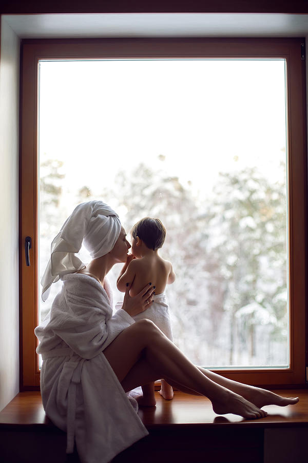 Winter Photograph - Mom And Son Sitting By The Window On A Wide Windowsill #3 by Elena Saulich