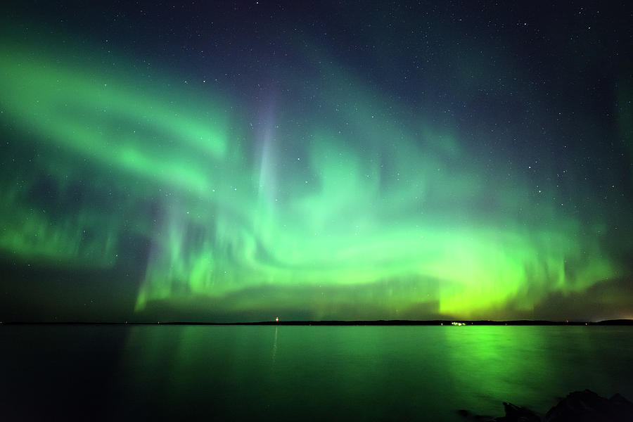 Northern lights over lake in Finland Photograph by Juhani Viitanen - Pixels