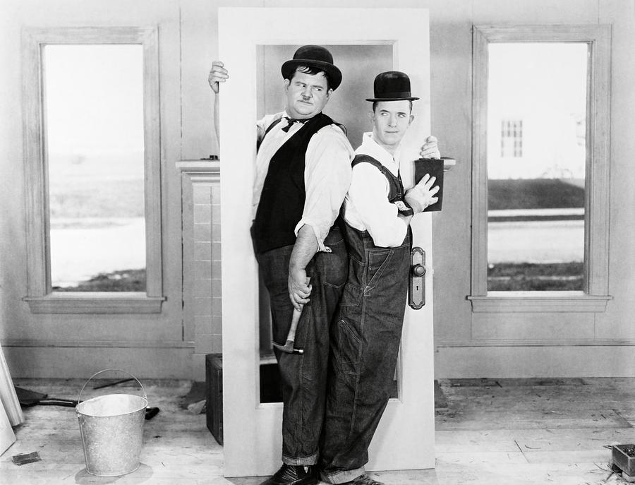 OLIVER HARDY and STAN LAUREL in THE FINISHING TOUCH -1928-. #3 Photograph by Album