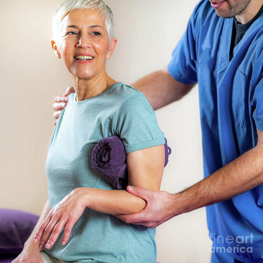 Physical Therapist Examining Patients Arm #3 Photograph by Microgen Images/science Photo Library