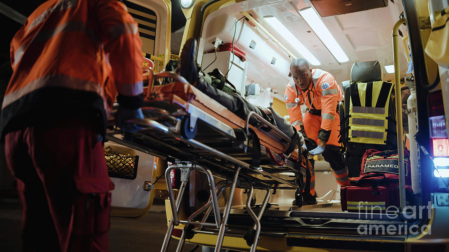 Team Of Paramedics Providing Medical Help #3 Photograph by Gorodenkoff Productions/science Photo Library