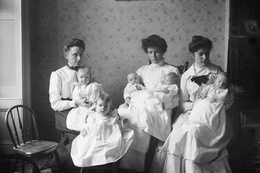 Babies Painting - 3 Women Holding 5 Babies In Day Nursery by Unknown