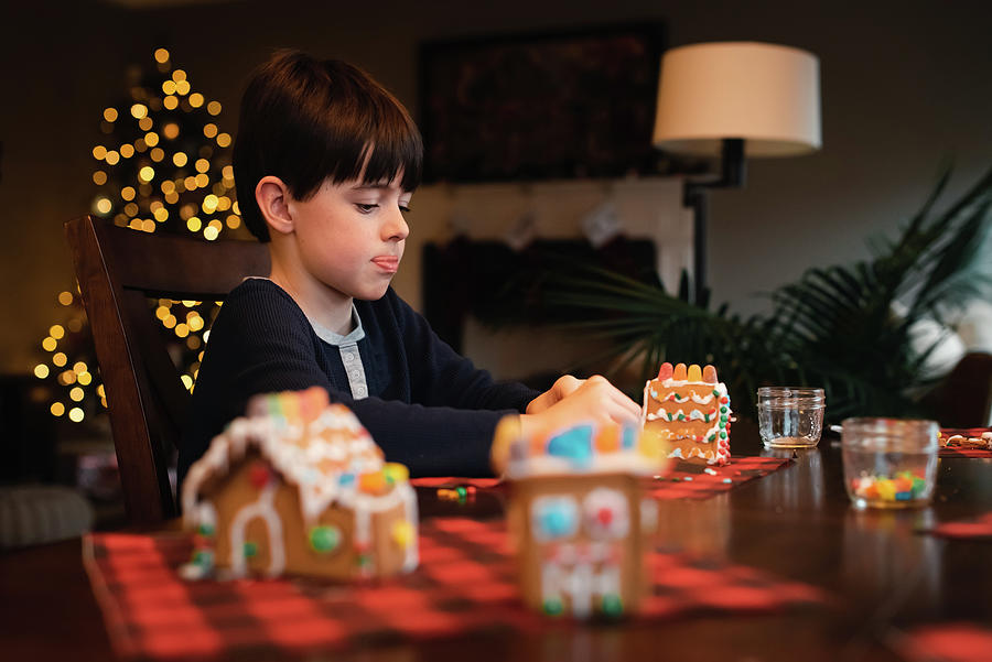 Christmas Photograph - Young Boy Decorating Gingerbread House With Candy At Christmas. #3 by Cavan Images