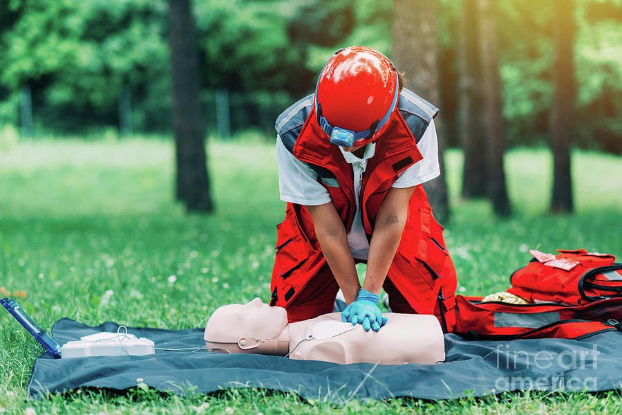 Aid Photograph - Cpr Training by Microgen Images/science Photo Library Aid Photograph - Cpr Training by Microgen Images/science Photo Library