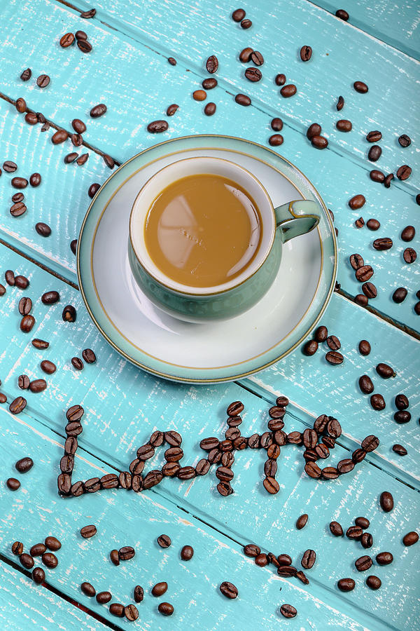 Cup of coffee on a wooden background by Ben Gingell Cup of coffee on a wooden background by Ben Gingell