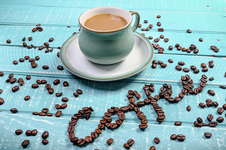 Cup of coffee on a wooden background by Ben Gingell Cup of coffee on a wooden background by Ben Gingell