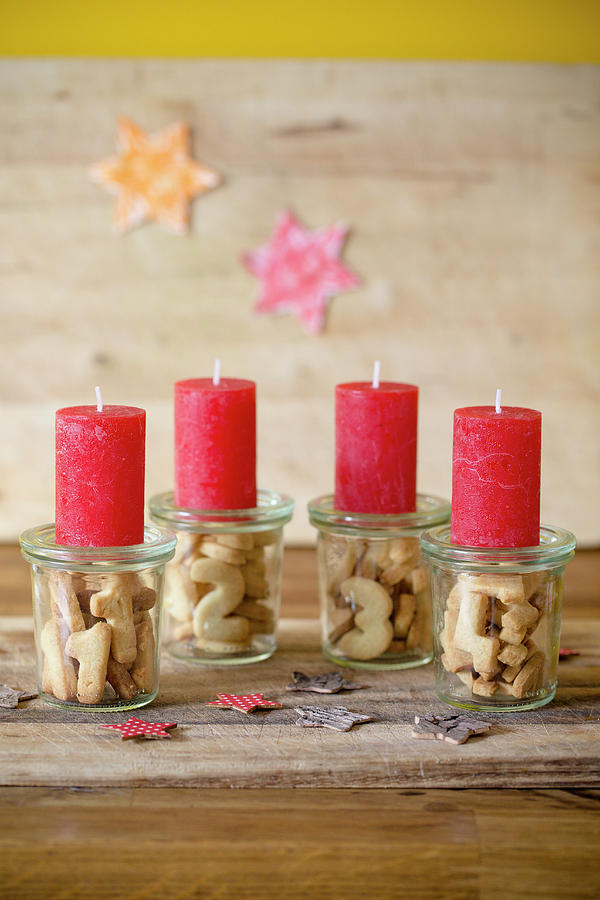 Alternative Advent Wreath Made From Candles On Mason Jars Containing Biscuit Numbers 1-4 #4 Photograph by Iris Wolf