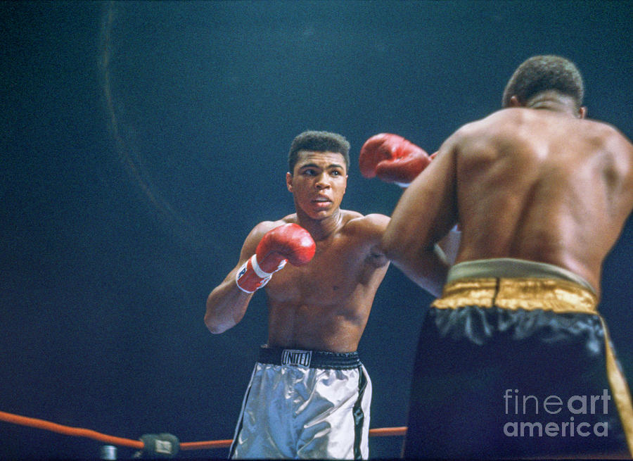 Cassius Clay Vs Archie Moore #4 Photograph by The Stanley Weston Archive