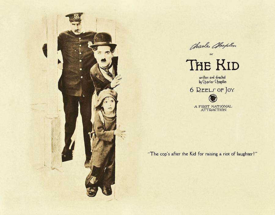 CHARLIE CHAPLIN and JACKIE COOGAN in THE KID -1921-. #4 Photograph by Album