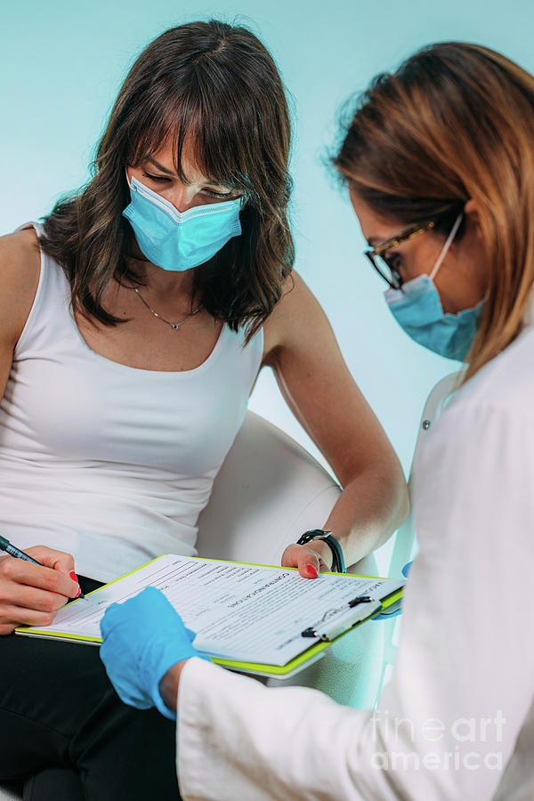 Female Patient Filling In Vaccine Information Statement #4 Photograph by Science Photo Library Female Patient Filling In Vaccine Information Statement #4 Photograph by Science Photo Library
