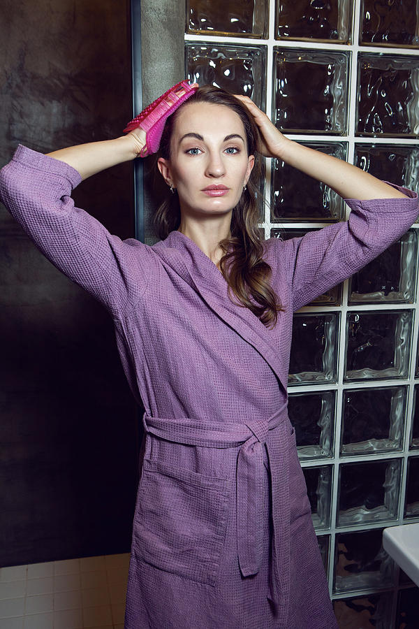 Girl Stands In The Bathroom In A Purple Robe Photograph
