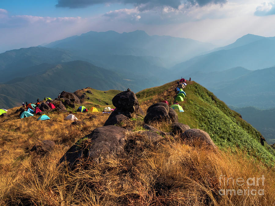 Summer Photograph - Tourists camp on the high ground and have a mountain background. by Tosporn Preede