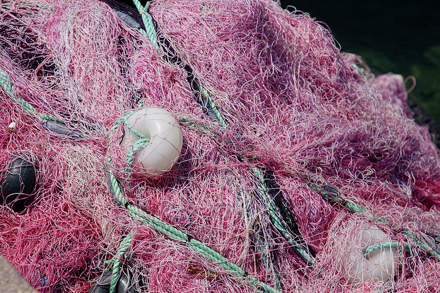 Multi-colored nylon fishing nets and floats Photograph by Steve Estvanik