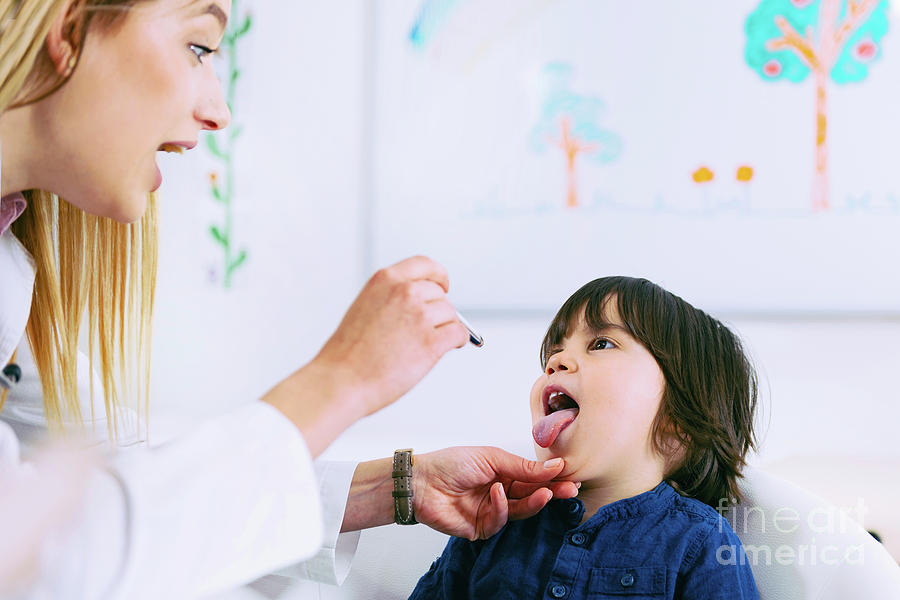 Paediatrician Examining Boys Throat #4 Photograph by Microgen Images/science Photo Library