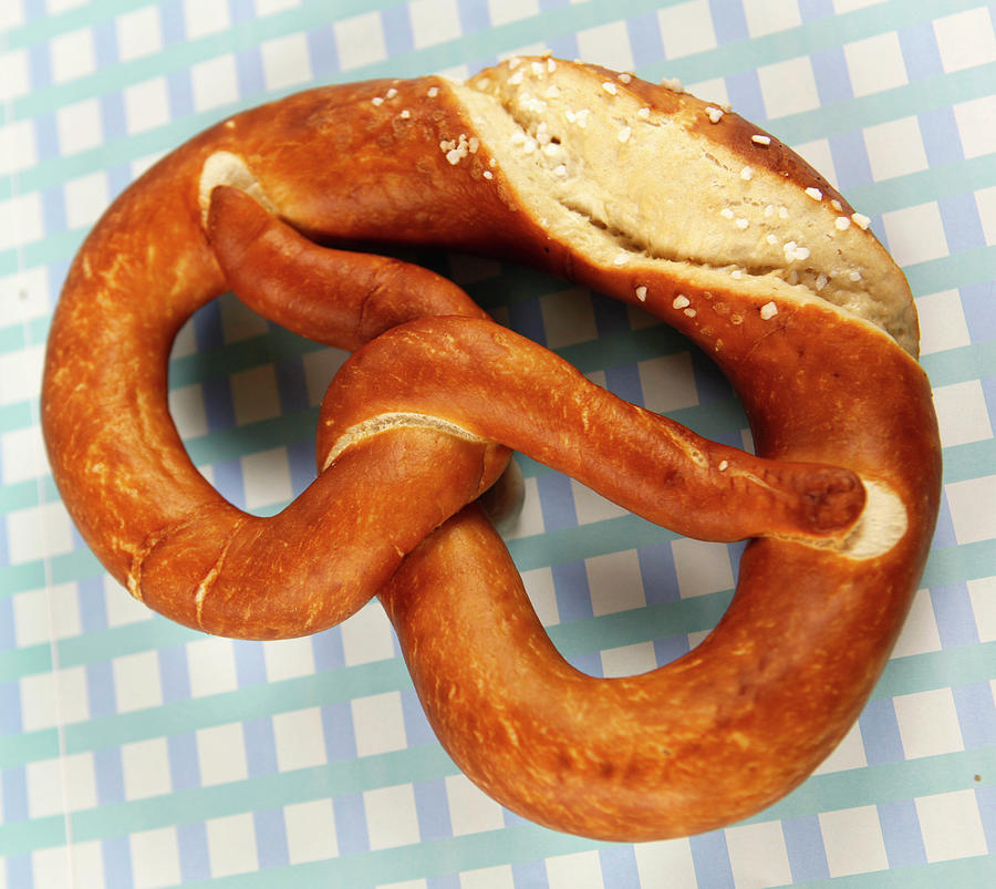 Pretzel Cut At Edge On White Background Photograph by Jalag-fotostudio ...