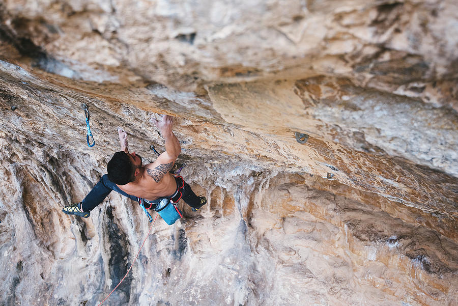 Shirtless Climber Sending A Sport Climbing Route On Spanish Crag ...