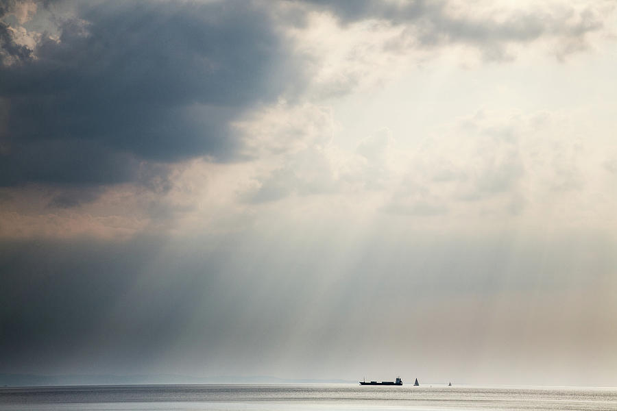 Sunrays scattered by clouds over Trieste Bay #4 Photograph by Ian Middleton