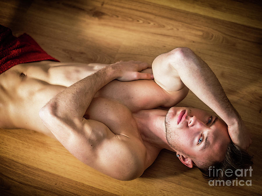 White Photograph - Totally naked muscular young man laying on floor by Stef...