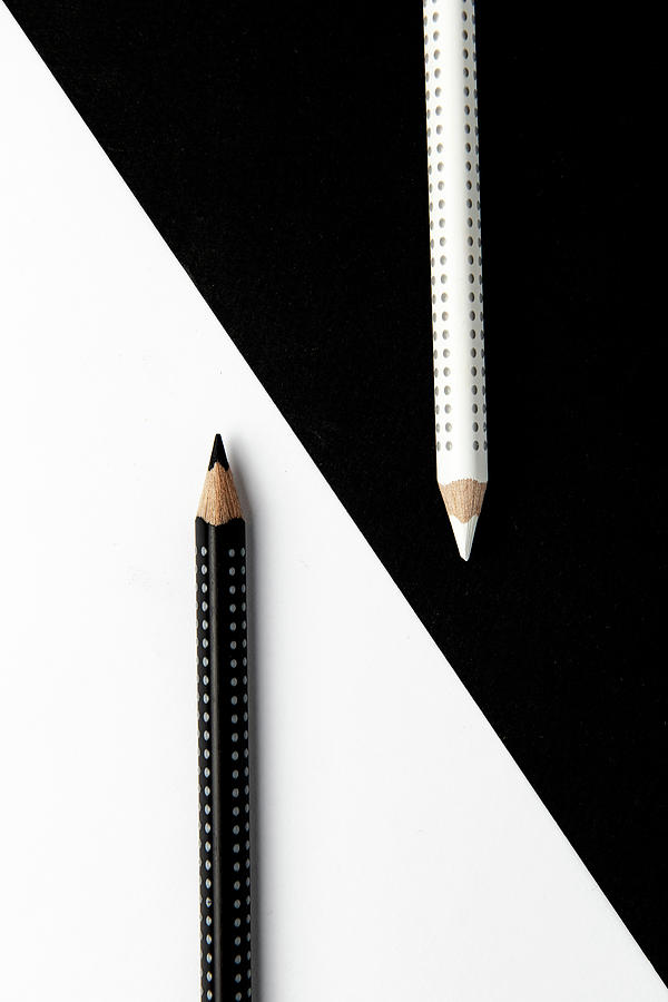Two Drawing Pencils On A Black And White Surface. Photograph