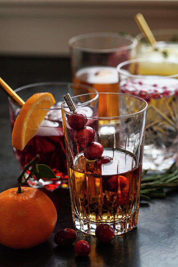 Various Alcoholic Drinks With Whisky, Bourbon, Vodka, Cranberry, Oranges, Pomegranates, Rosemary And Thyme #4 Photograph by Ryla Campbell