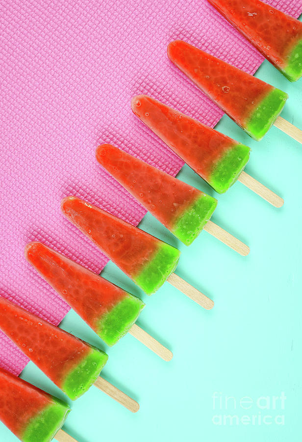 Watermelon flavored summer ice cream popsicles on pink and blue background. #4 Photograph by Milleflore Images