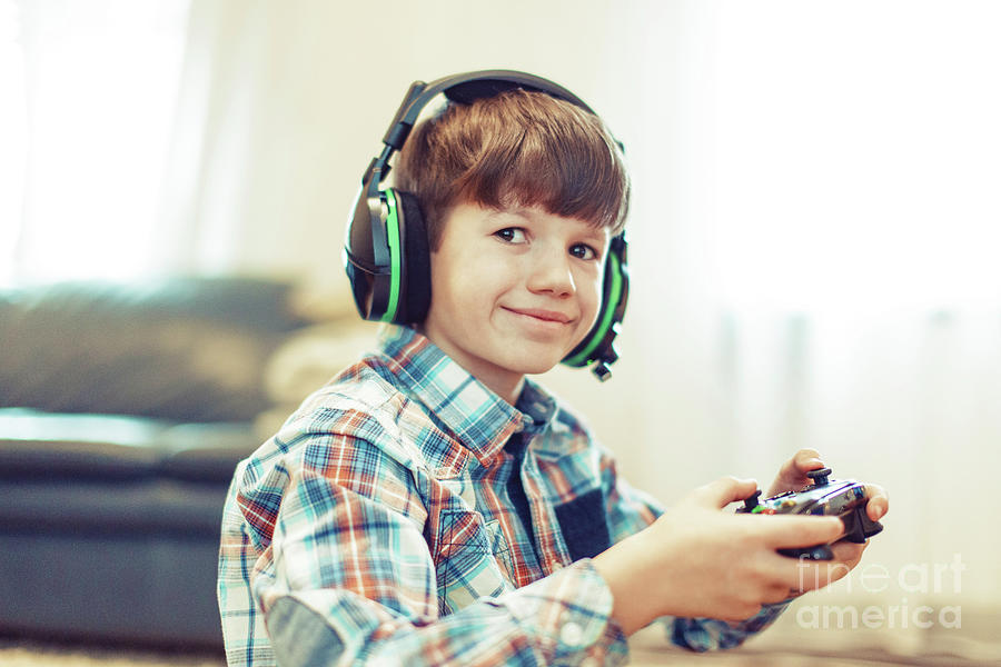Young Boy Playing Video Game #4 Photograph by Sakkmesterke/science Photo Library