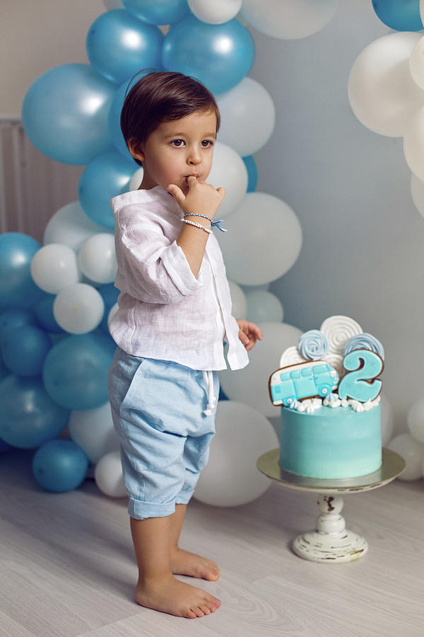 Baby Boy In Blue Pants And Shirt Standing On The Floor Photograph By 