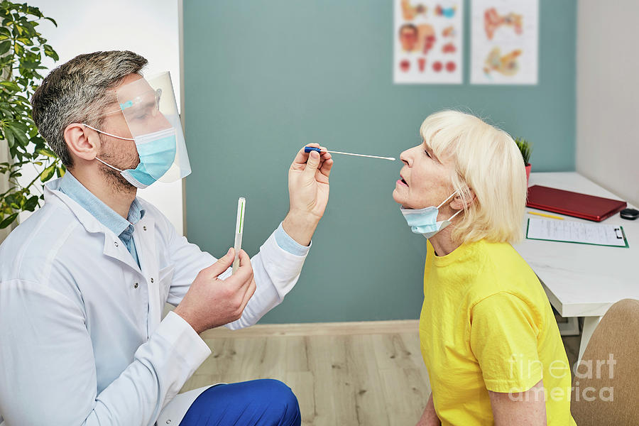 Doctor Taking Nasal Swab #5 by Peakstock / Science Photo Library