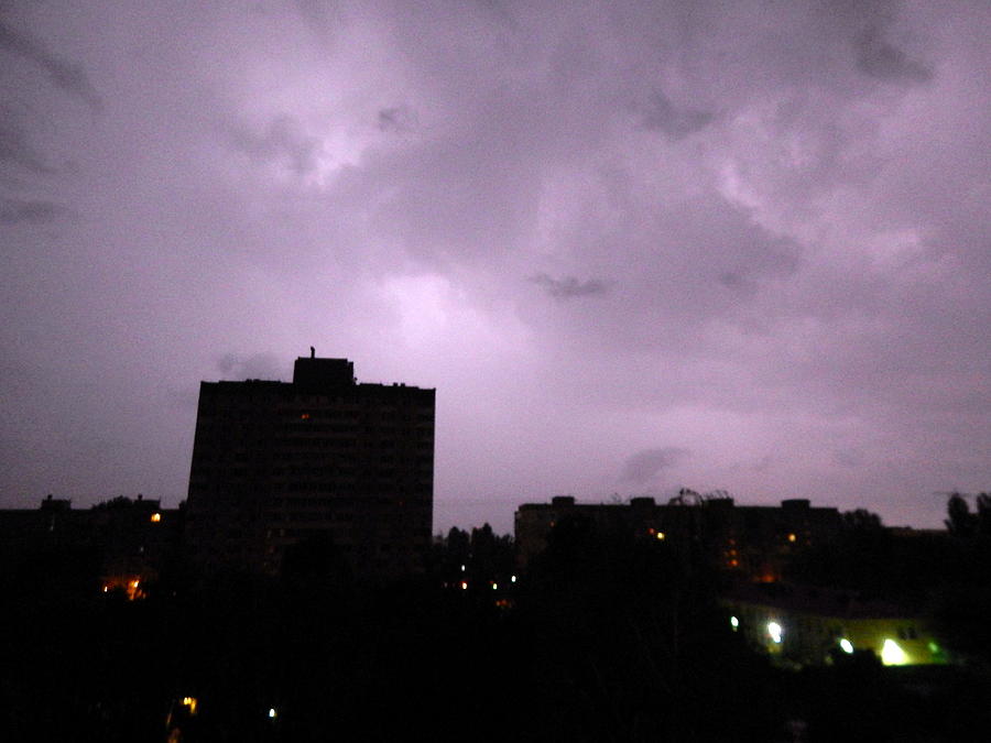 Nature Photograph - Lightning and thunder at night in the city its raining #5 by Oleg Prokopenko