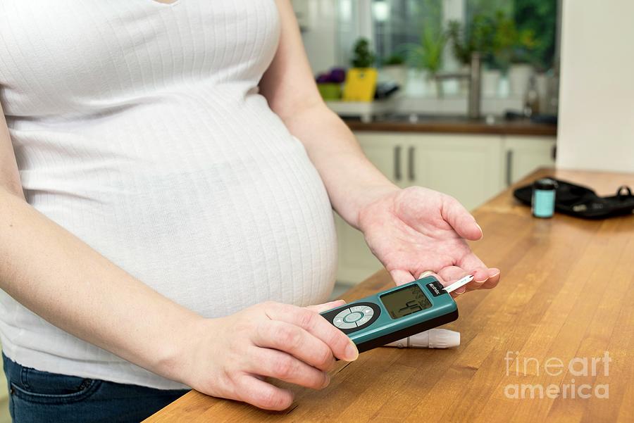 Pregnant Woman Testing Blood Sugar Level In Diabetes Photograph By