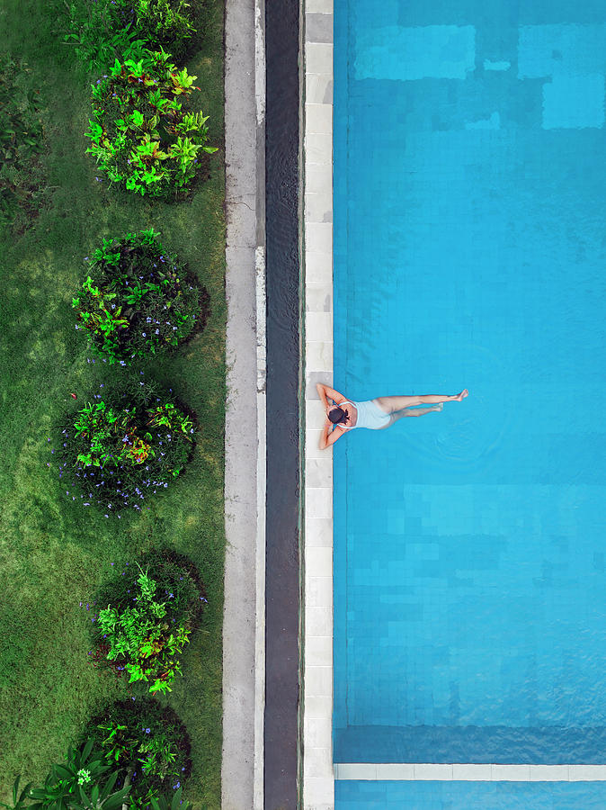 Aerial View Of Attractive Woman Floating Over Water At Resort ...