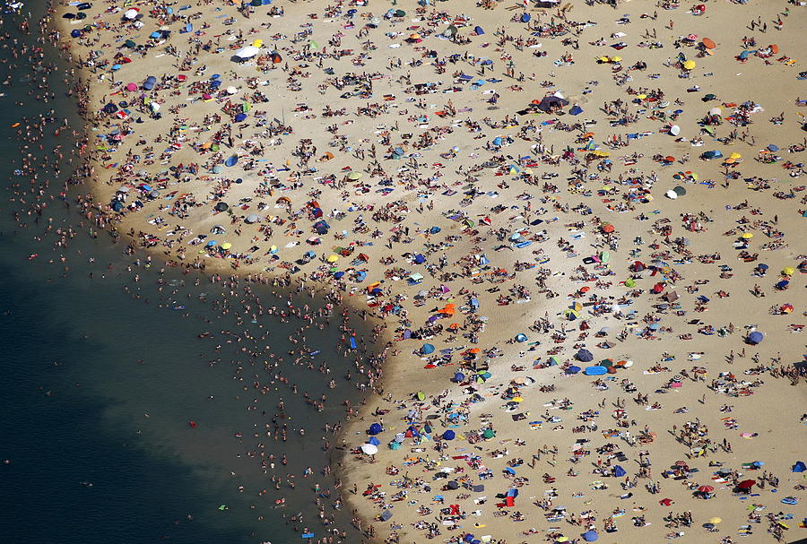 An Aerial View Shows People at a Beach Photograph by Ina Fassbender ...