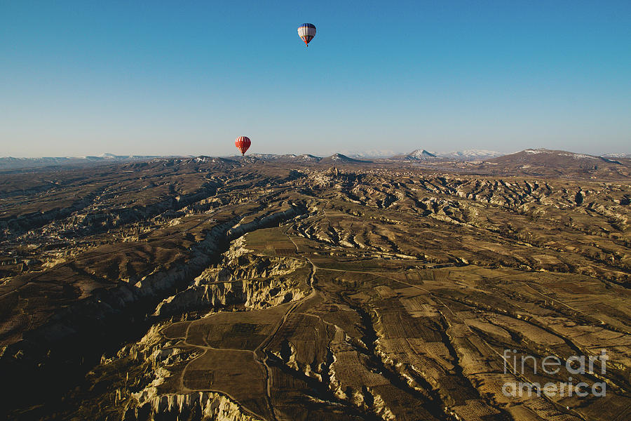 Colorful balloons flying over mountains and with blue sky #6 Photograph by Joaquin Corbalan