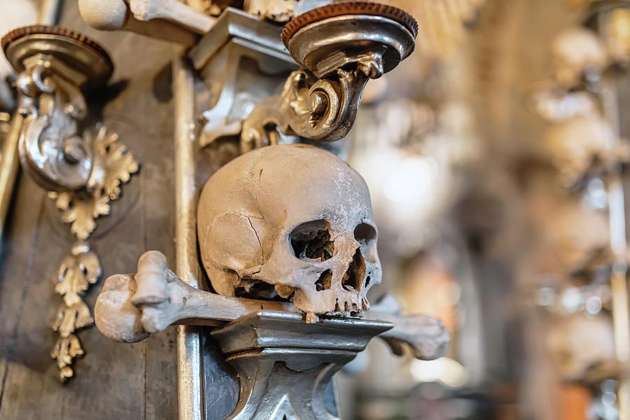 Halloween Photograph - Human skulls and bones in ossuary Sedlec Kostnice #6 by Artush Foto