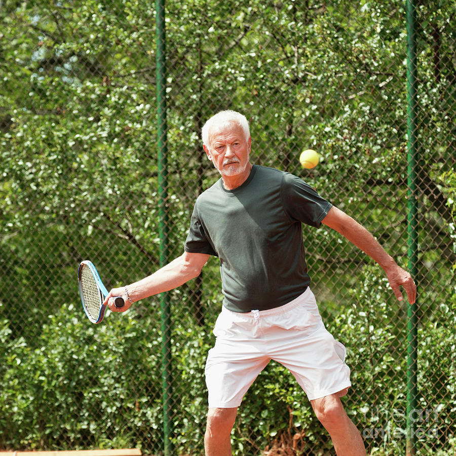 Active Senior Man Playing Tennis #7 Photograph by Microgen Images/science Photo Library