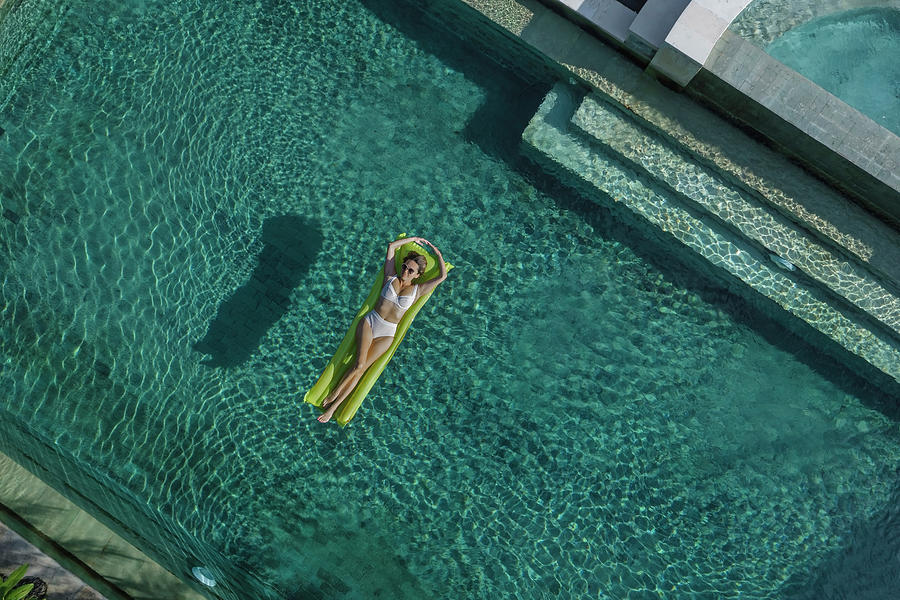 Aerial View Of Woman In Pool Photograph by Cavan Images / Konstantin ...