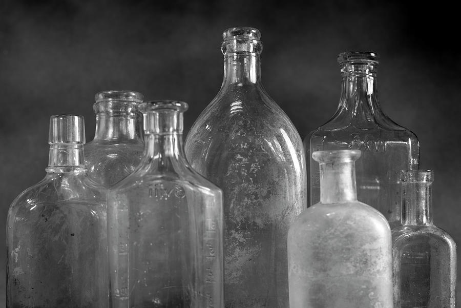 7 Bottles Photograph by Moises Levy - Pixels