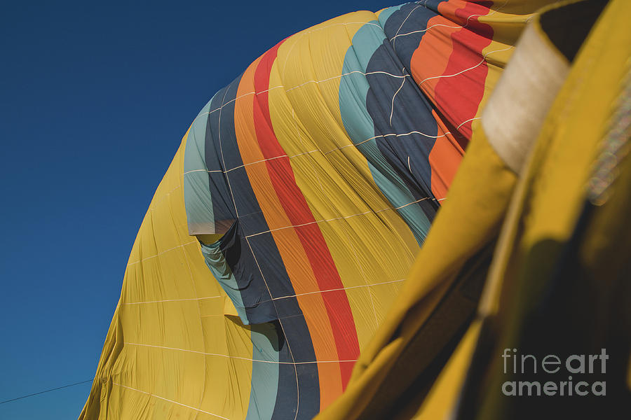Colorful balloons flying over mountains and with blue sky #7 Photograph by Joaquin Corbalan