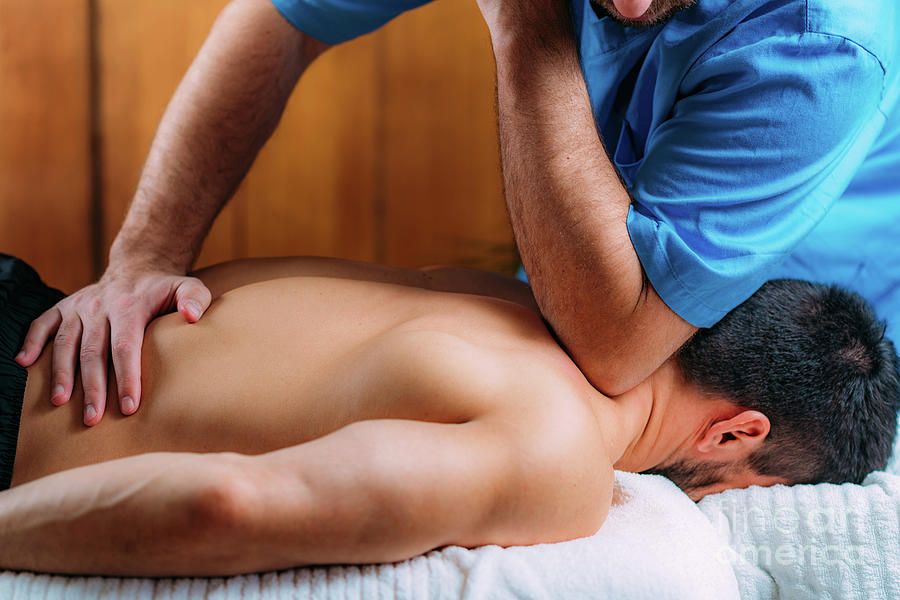 Physiotherapist Massaging Patients Shoulder #7 Photograph by Microgen Images/science Photo Library