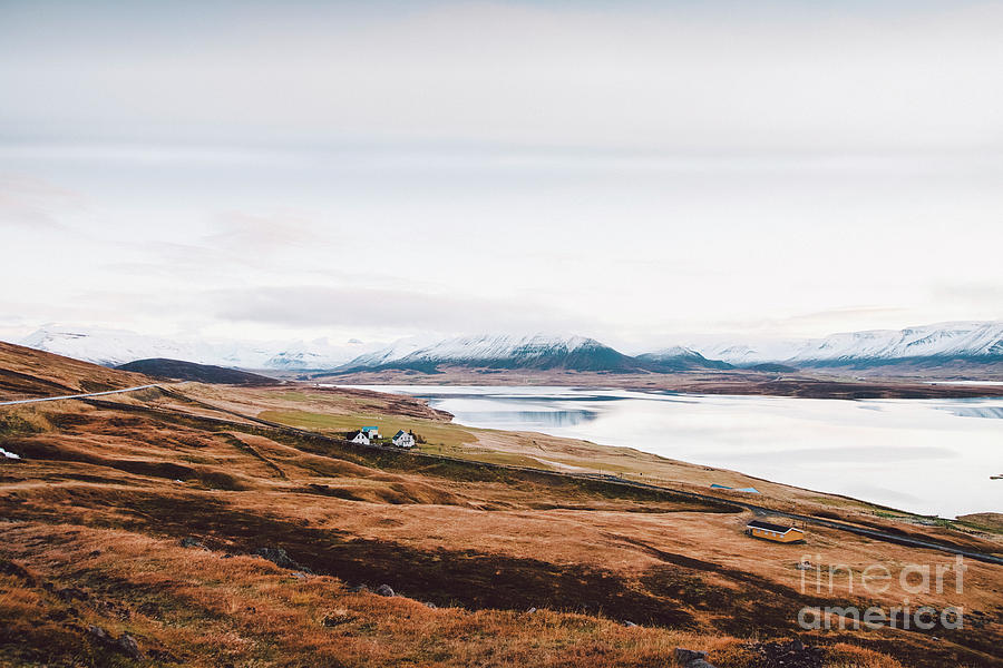 Village with farms in a rural area of the mountains of Iceland, with snowy mountains in the background. #7 Photograph by Joaquin Corbalan