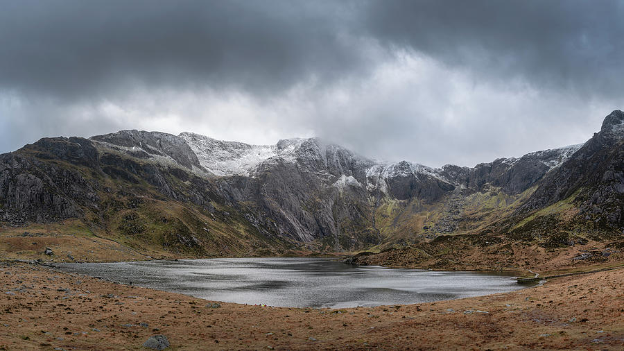Winter Photograph - Beautiful moody Winter landscape image of Llyn Idwal and snowcap #8 by Matthew Gibson